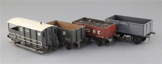 A Triang open truck, no.B71411, in grey, a G.W. open wagon 8T, no.42573, in black, a Moore open wagon, no.117,